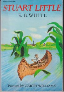 Book cover for Stuart Little with a mouse in a canoe.